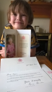 Norah's 6th Great Grandson with his letter from Her Majesty - in celebration of her 90th Birthday.